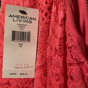 Nice dress!! Pink size 10 lace with lining underneath. Never worn!!